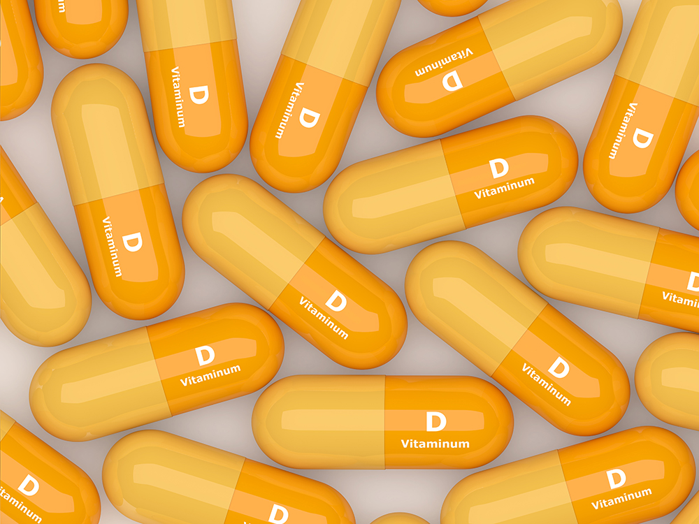 vitamin-D-pills-lying-on-table-528575152_6000x4500