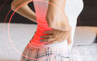 Woman sitting in her back in back pain